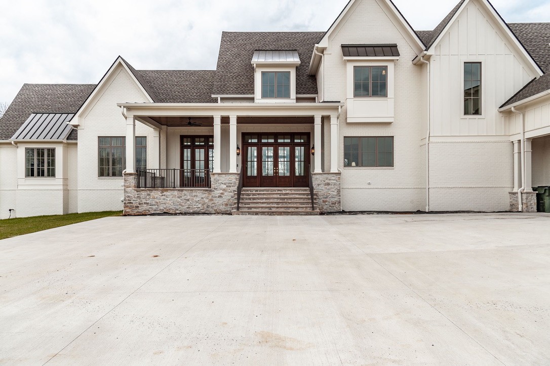 197 E Bugg Hollow Road Cottontown, TN 37048 - Photo 3 of 61 a front view of a house with a yard