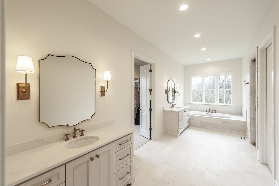 197 E Bugg Hollow Road Cottontown, TN 37048 - Photo 33 of 61 a bathroom with a double vanity sink mirror and bathtub