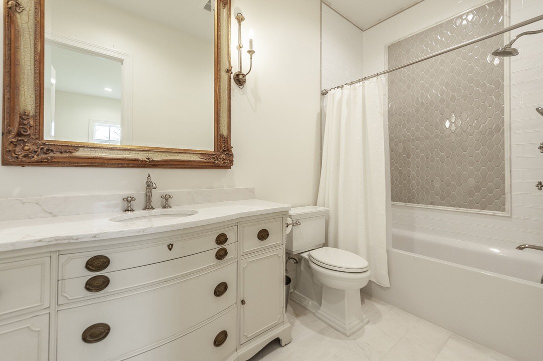197 E Bugg Hollow Road Cottontown, TN 37048 - Photo 39 of 61 a bathroom with a sink a toilet a mirror and shower