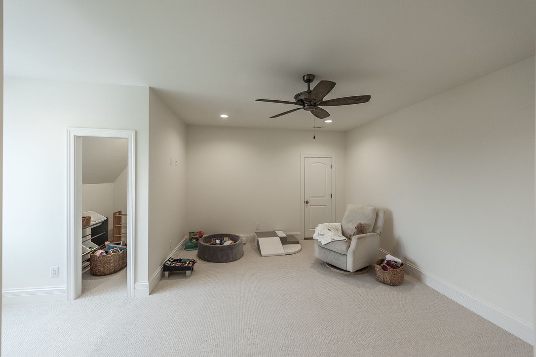 197 E Bugg Hollow Road Cottontown, TN 37048 - Photo 47 of 61 a view of a livingroom with furniture and a ceiling fan
