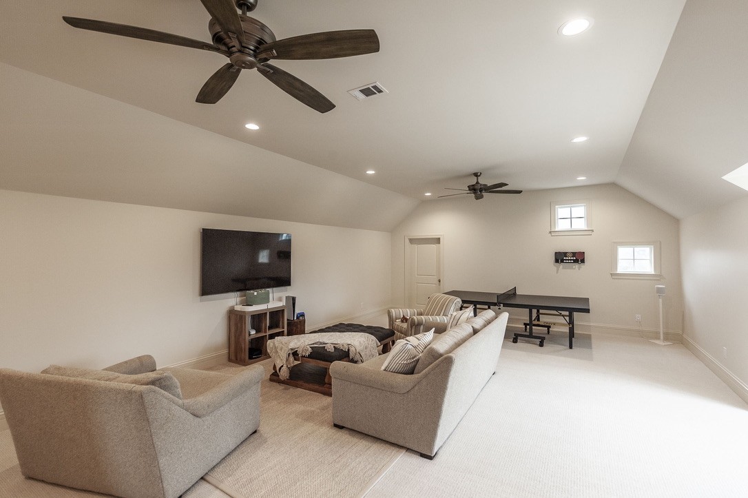 197 E Bugg Hollow Road Cottontown, TN 37048 - Photo 52 of 61 a living room with furniture and a flat screen tv