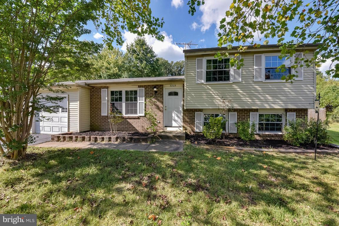 5809 Heming Avenue Springfield, VA 22151 - Photo 1 of 22 a view of a house with a yard patio and fire pit