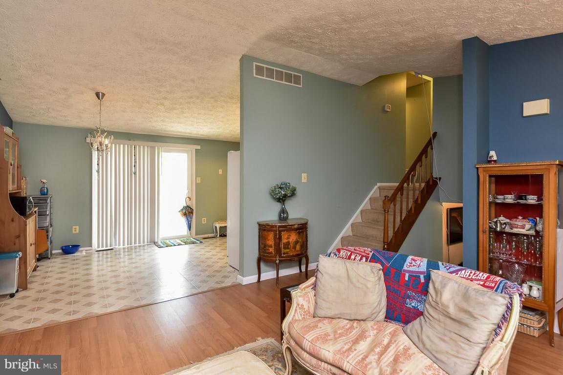 5809 Heming Avenue Springfield, VA 22151 - Photo 2 of 22 a living room with furniture and stairs