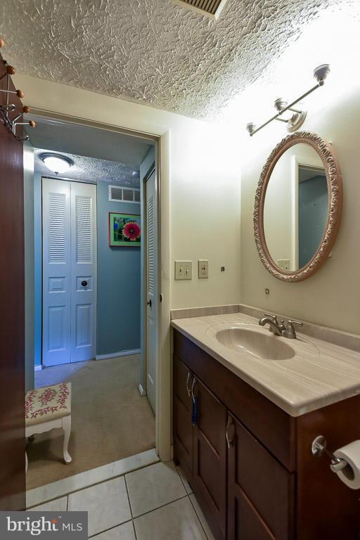 5809 Heming Avenue Springfield, VA 22151 - Photo 11 of 22 a bathroom with a sink and a mirror