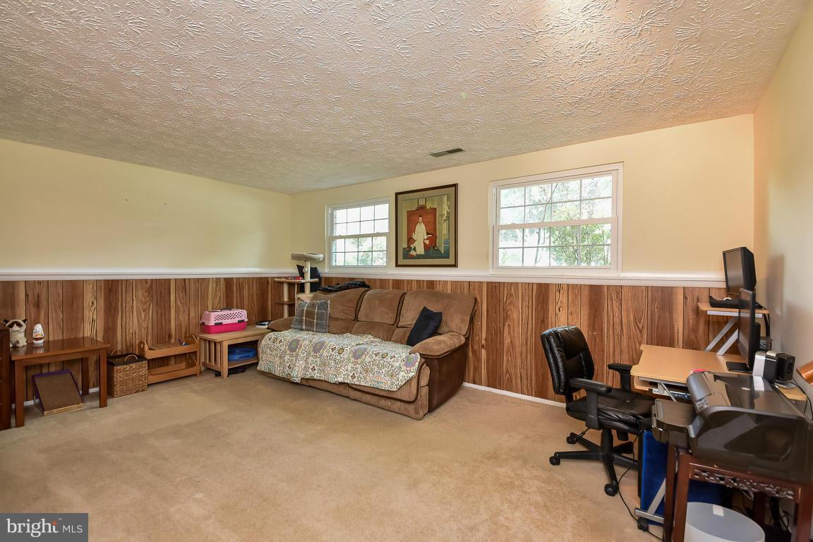 5809 Heming Avenue Springfield, VA 22151 - Photo 16 of 22 a bedroom with furniture and a window