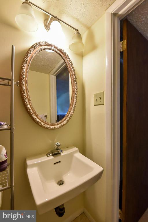 5809 Heming Avenue Springfield, VA 22151 - Photo 17 of 22 a bathroom with a sink and a mirror