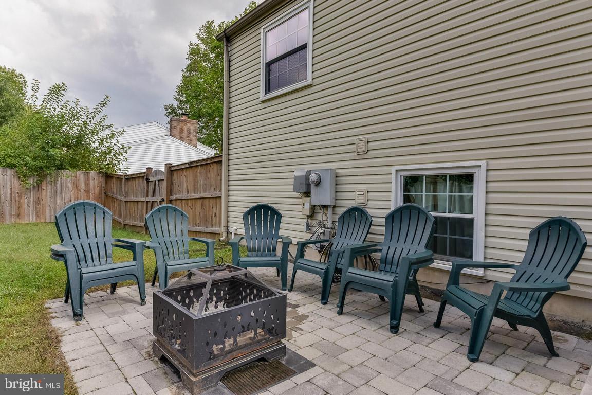 5809 Heming Avenue Springfield, VA 22151 - Photo 20 of 22 a view of a chair and tables in the back yard of the house