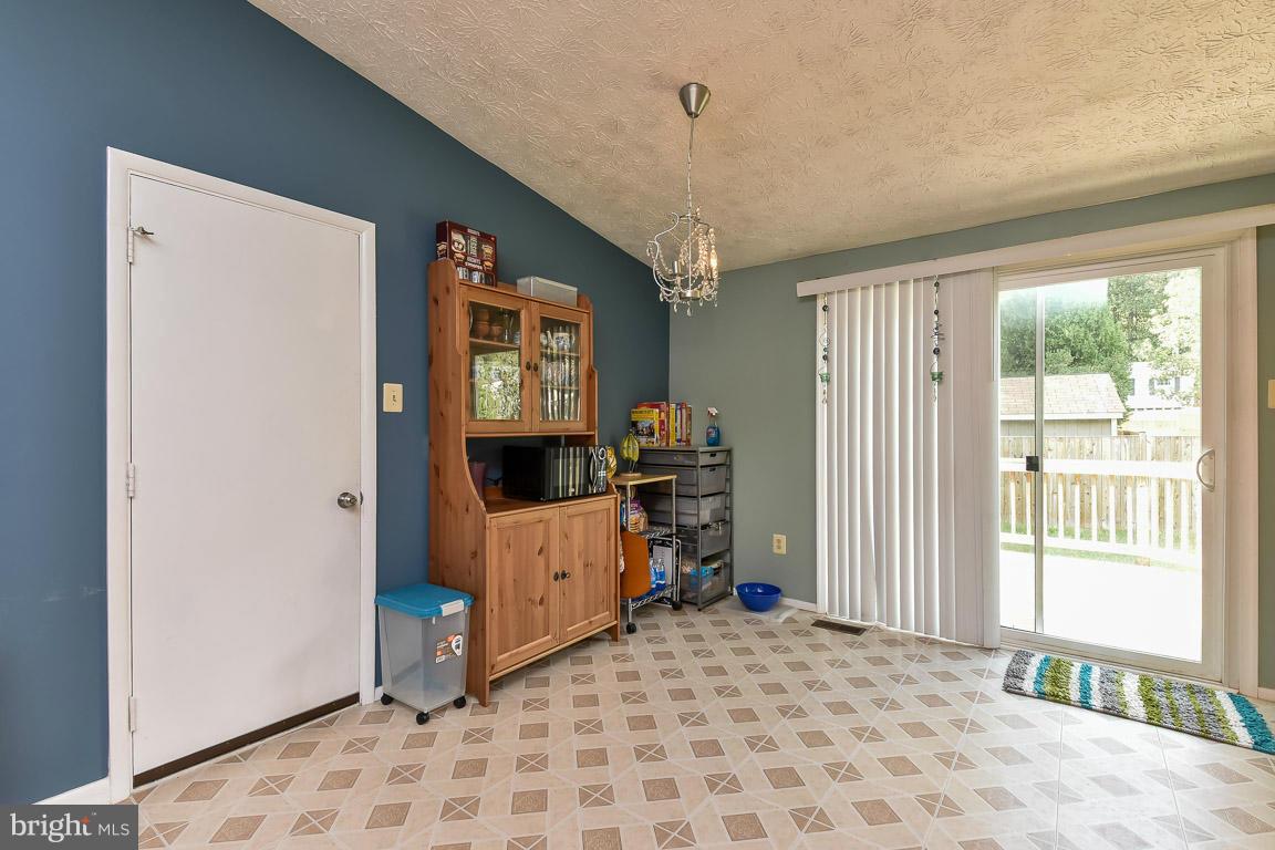 5809 Heming Avenue Springfield, VA 22151 - Photo 4 of 22 a view of a bedroom with workspace and a window