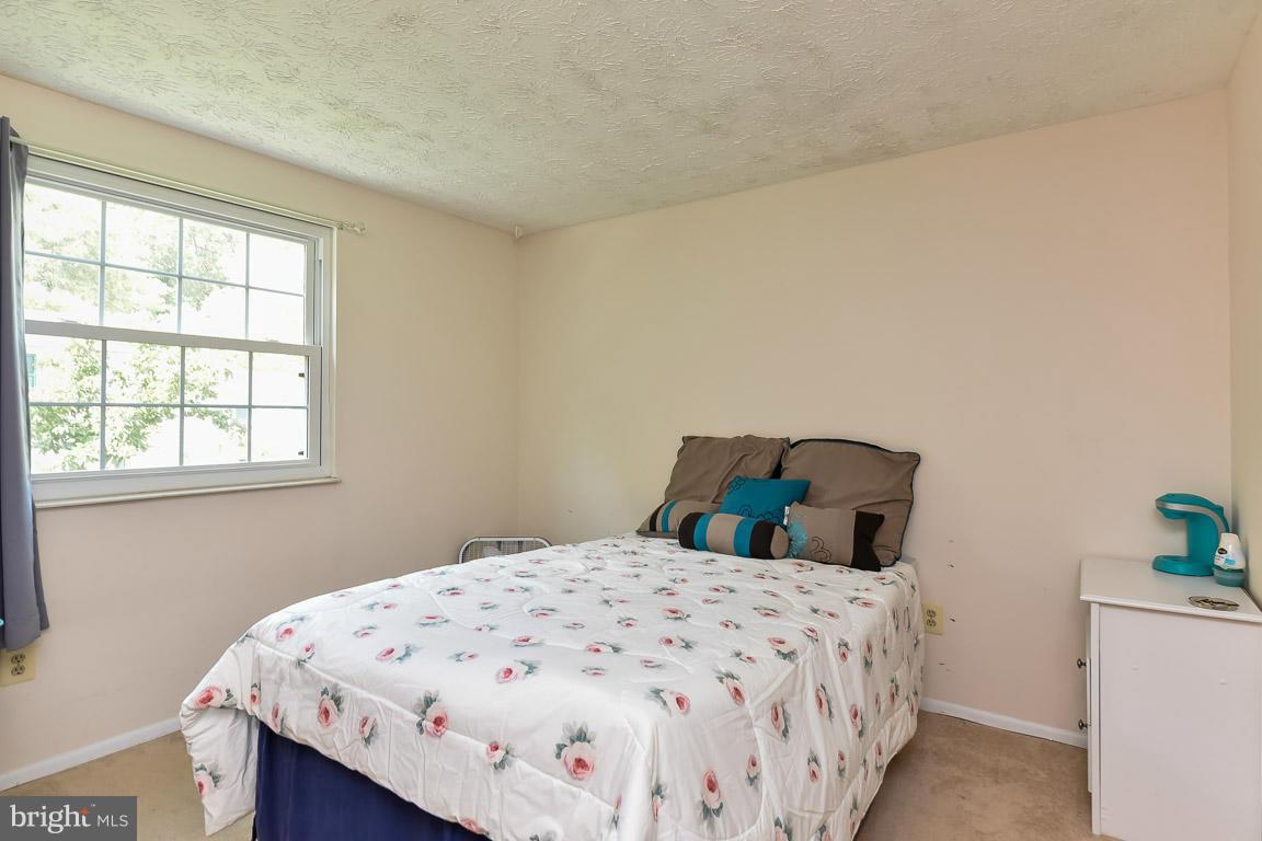 5809 Heming Avenue Springfield, VA 22151 - Photo 7 of 22 a bedroom with a bed and a window