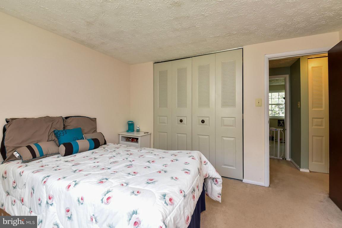 5809 Heming Avenue Springfield, VA 22151 - Photo 8 of 22 a bedroom with a bed and a closet
