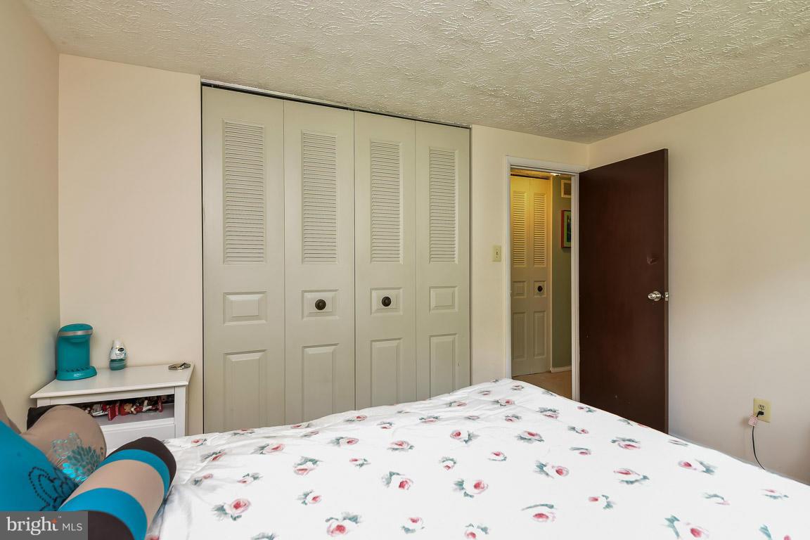 5809 Heming Avenue Springfield, VA 22151 - Photo 9 of 22 a bedroom with a bed and a curtain
