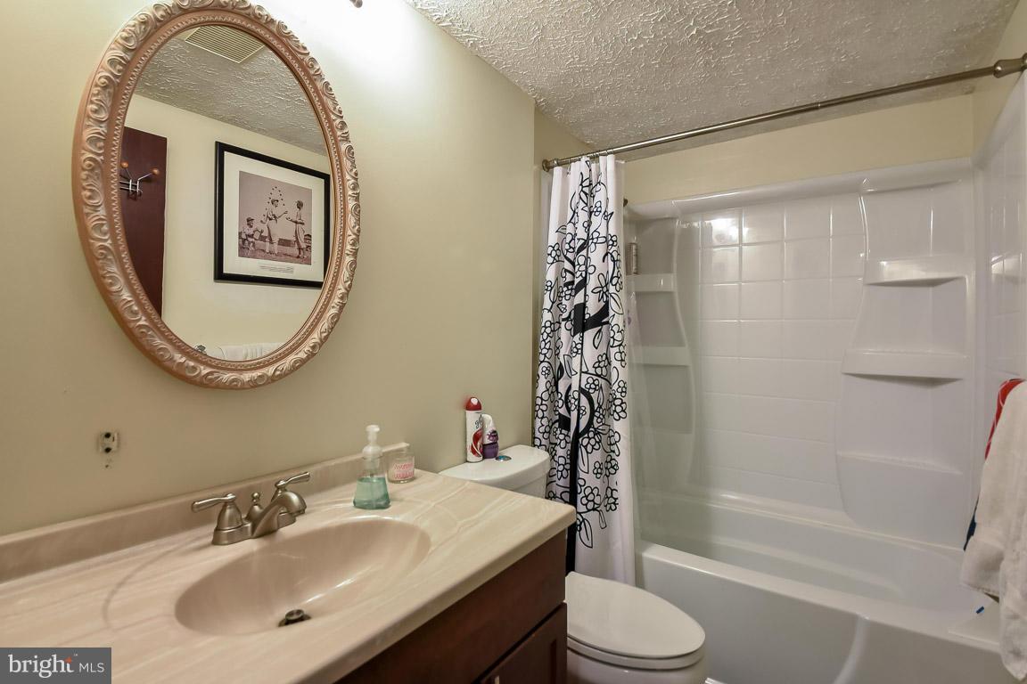 5809 Heming Avenue Springfield, VA 22151 - Photo 10 of 22 a bathroom with a sink toilet and shower