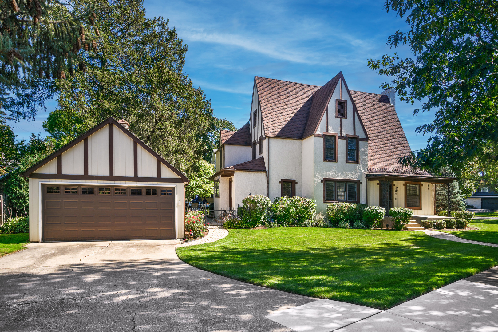 26 Park Lane Golf, IL 60029 - Photo 2 of 6 a front view of a house with a yard and garage