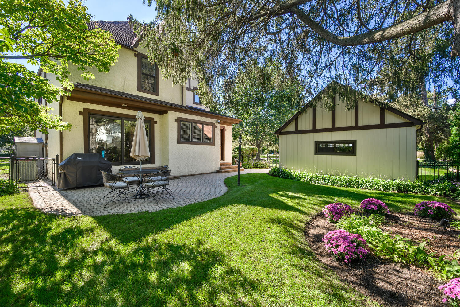 26 Park Lane Golf, IL 60029 - Photo 3 of 6 a view of a chair and table in backyard of the house