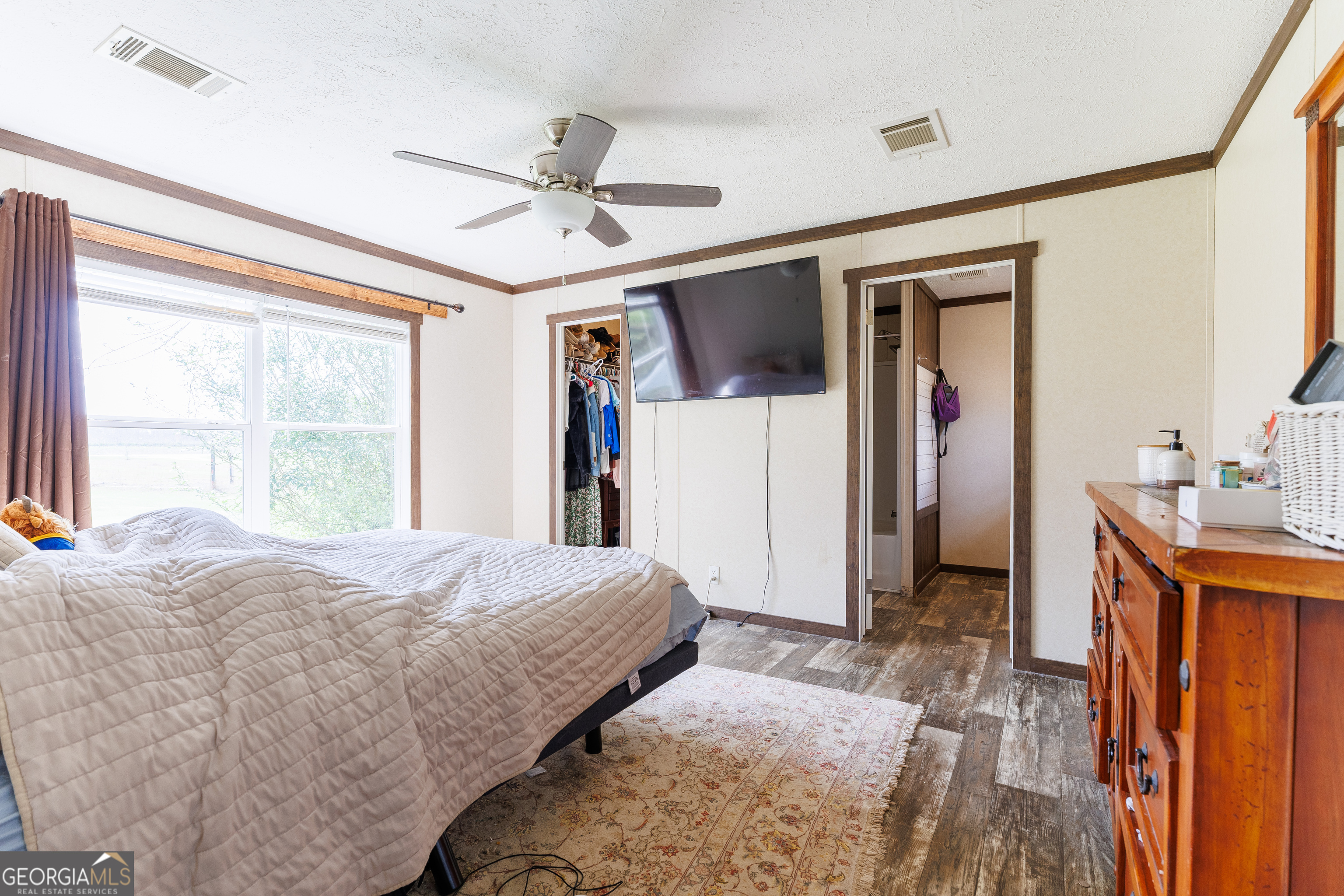1121 Futch Road Adel, GA 31620 - Photo 14 of 28 a bedroom with a bed and a window