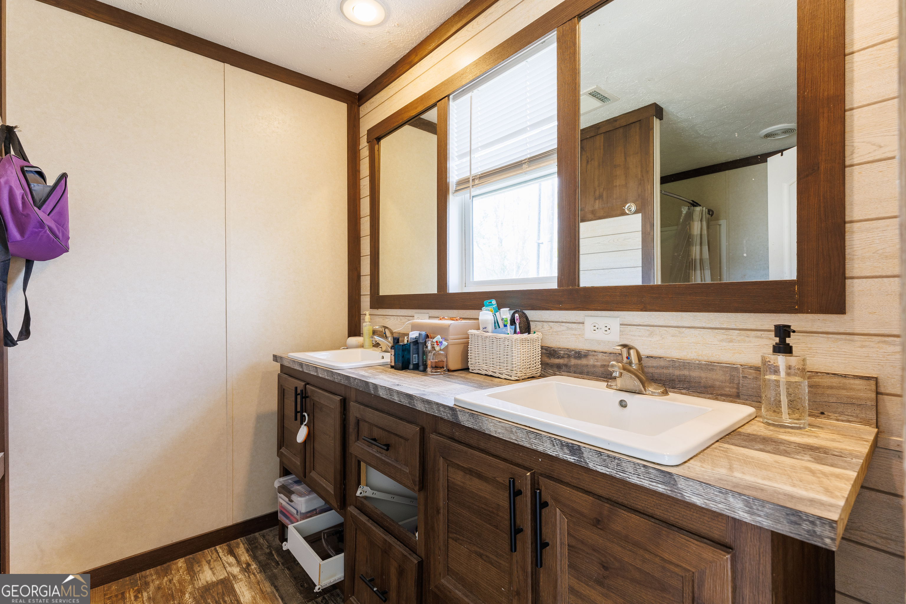 1121 Futch Road Adel, GA 31620 - Photo 16 of 28 a bathroom with a sink and a mirror