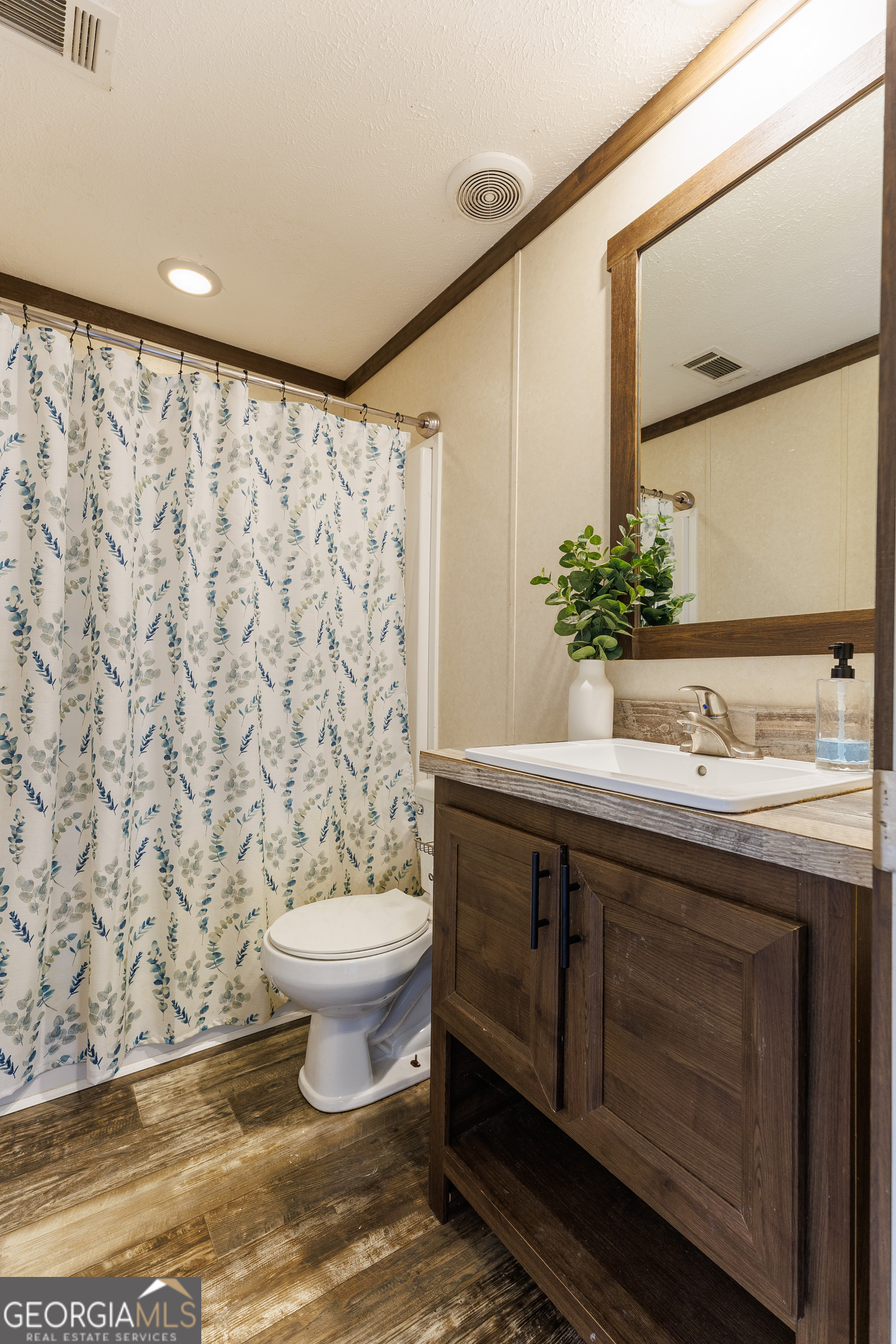 1121 Futch Road Adel, GA 31620 - Photo 20 of 28 a bathroom with a sink toilet and shower