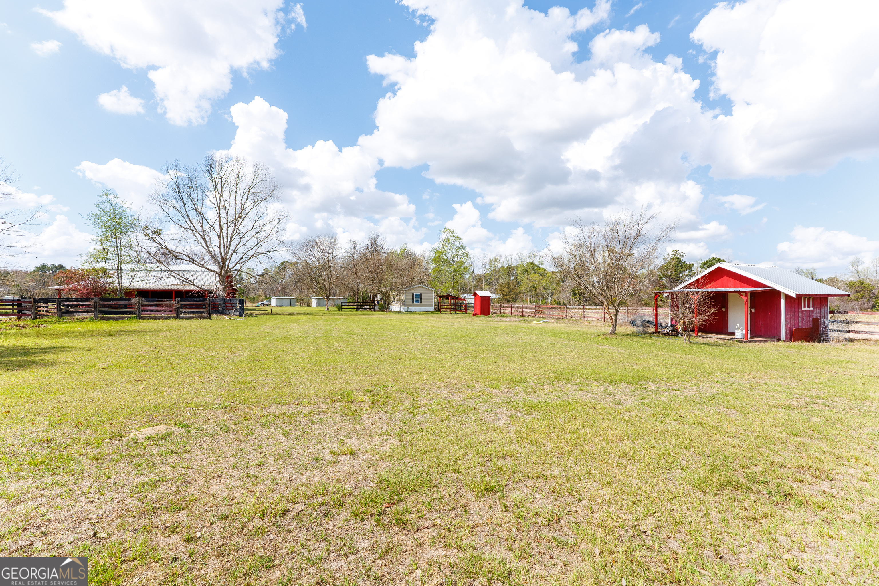 1121 Futch Road Adel, GA 31620 - Photo 24 of 28 a view of a garden with an trees