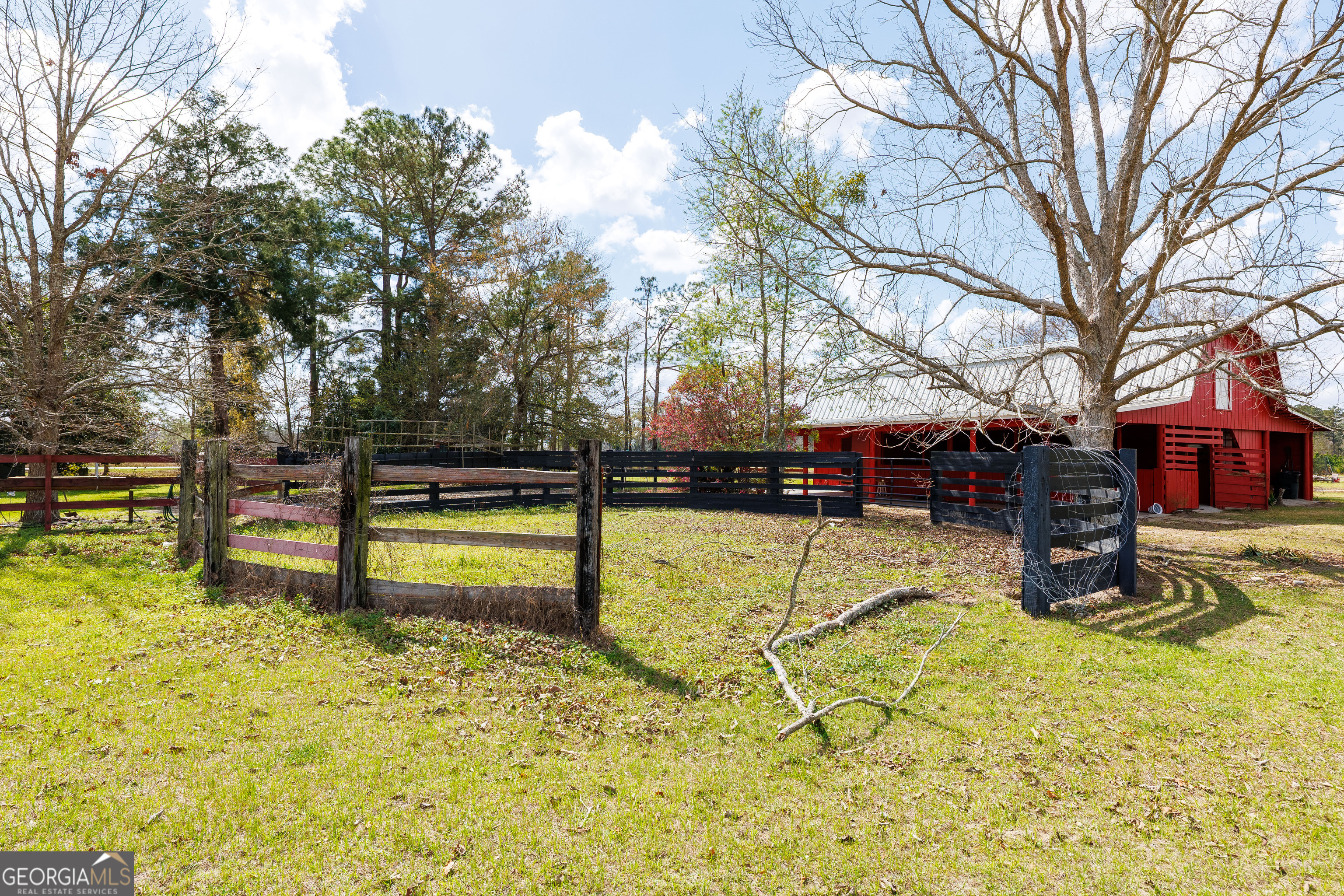 1121 Futch Road Adel, GA 31620 - Photo 25 of 28 a swimming pool with trees in the back yard