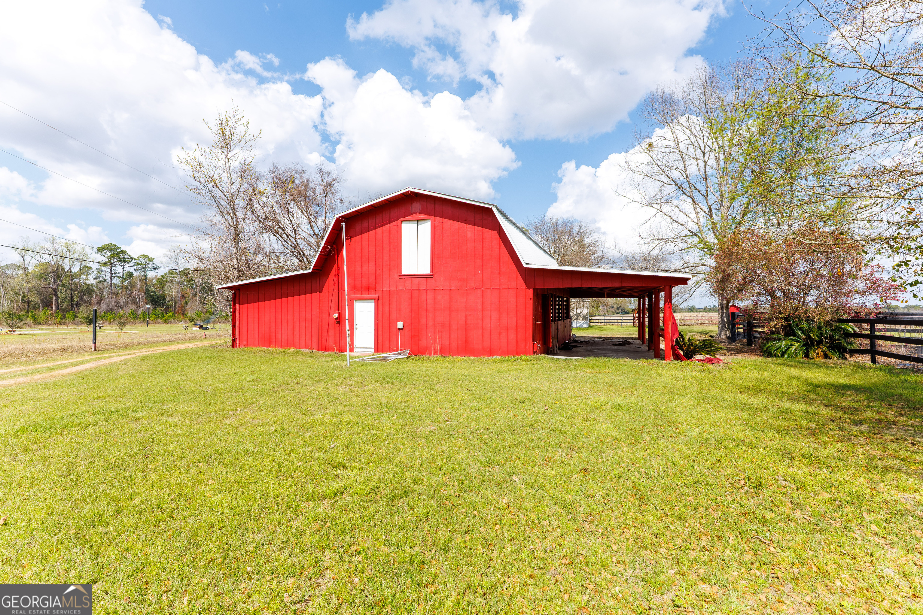 1121 Futch Road Adel, GA 31620 - Photo 3 of 28 a view of a yard with a house in the background