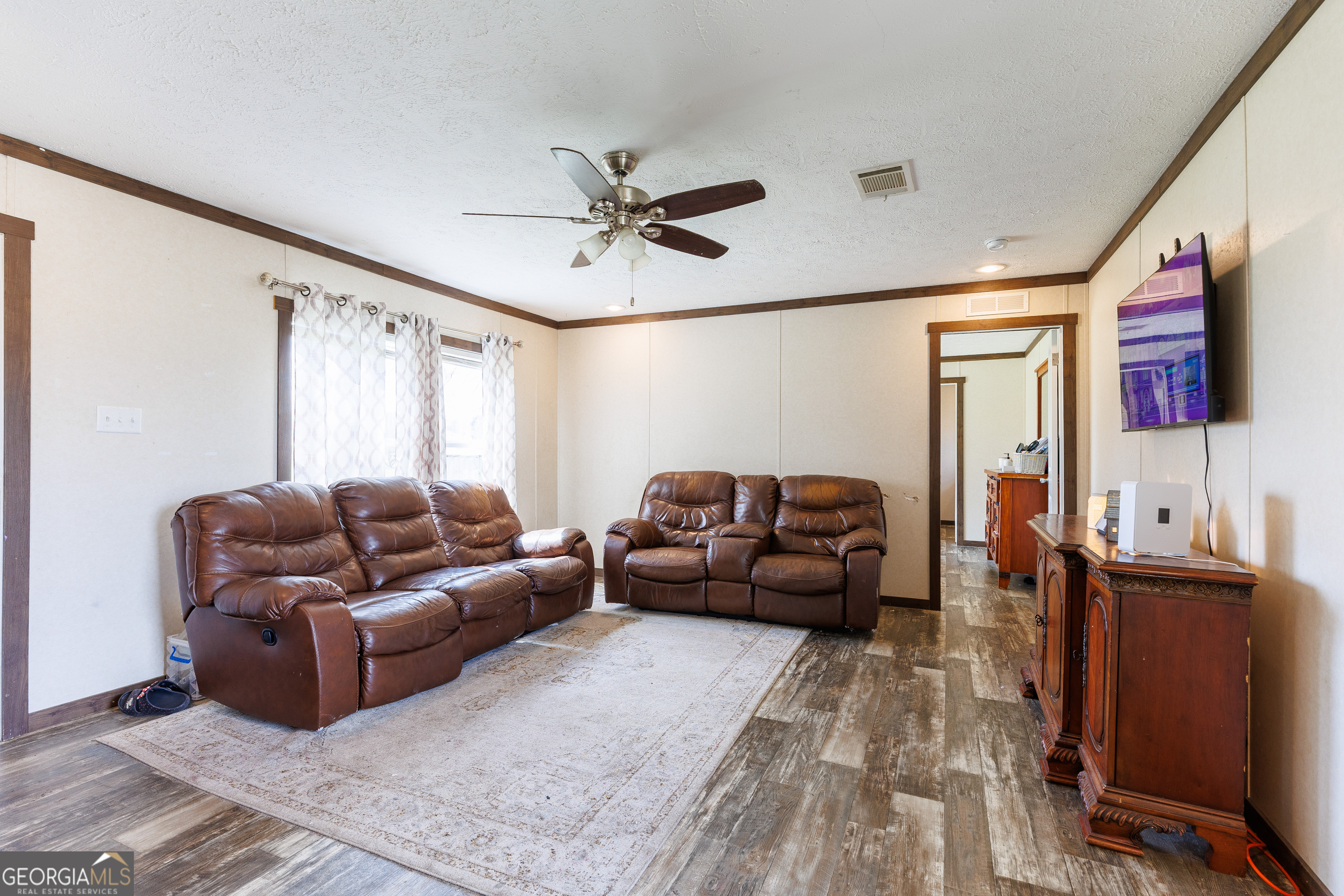 1121 Futch Road Adel, GA 31620 - Photo 6 of 28 a living room with furniture and a window