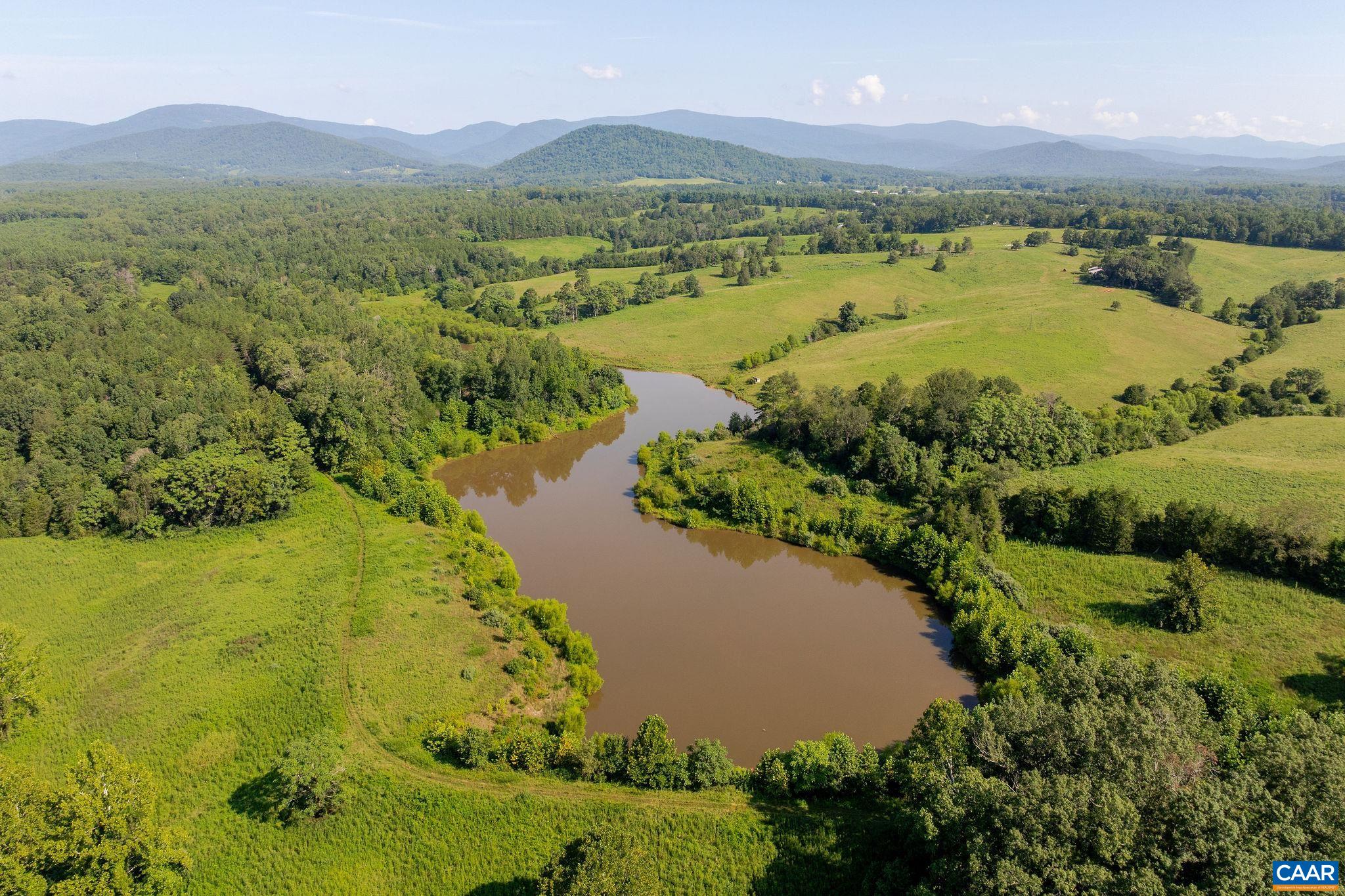 955 Simmons Gap Road Dyke, VA 22935 - Photo 13 of 33 a view of a lake with a mountain