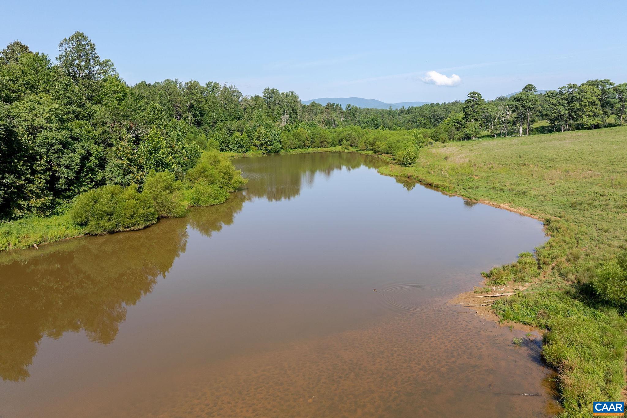 955 Simmons Gap Road Dyke, VA 22935 - Photo 17 of 33 a view of a lake with houses in the back