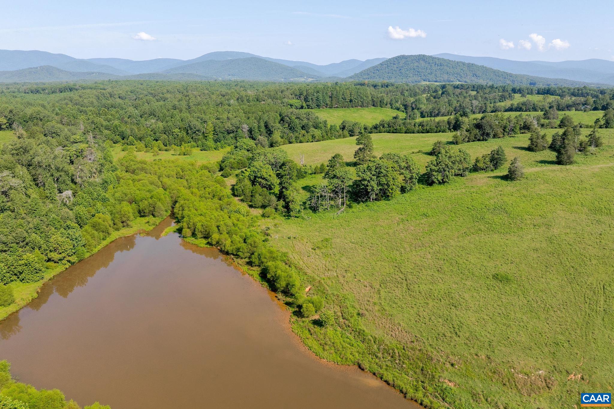 955 Simmons Gap Road Dyke, VA 22935 - Photo 18 of 33 a view of a lush green hillside and houses
