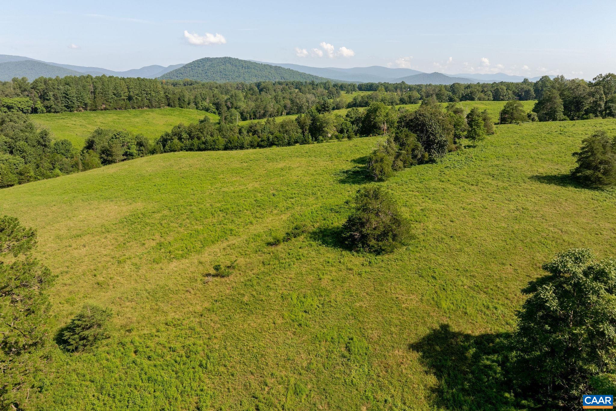 955 Simmons Gap Road Dyke, VA 22935 - Photo 21 of 33 a view of a lake with houses