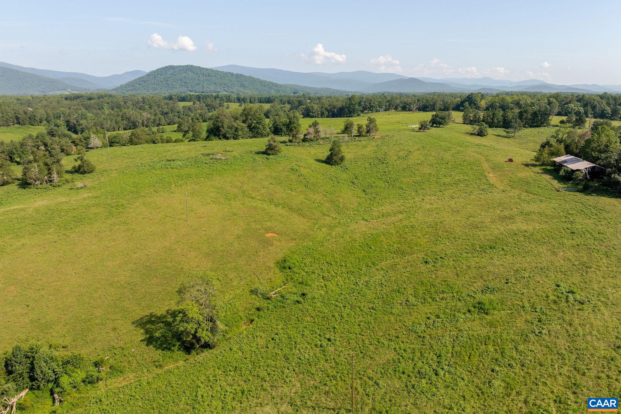 955 Simmons Gap Road Dyke, VA 22935 - Photo 32 of 33 a view of a lake with houses