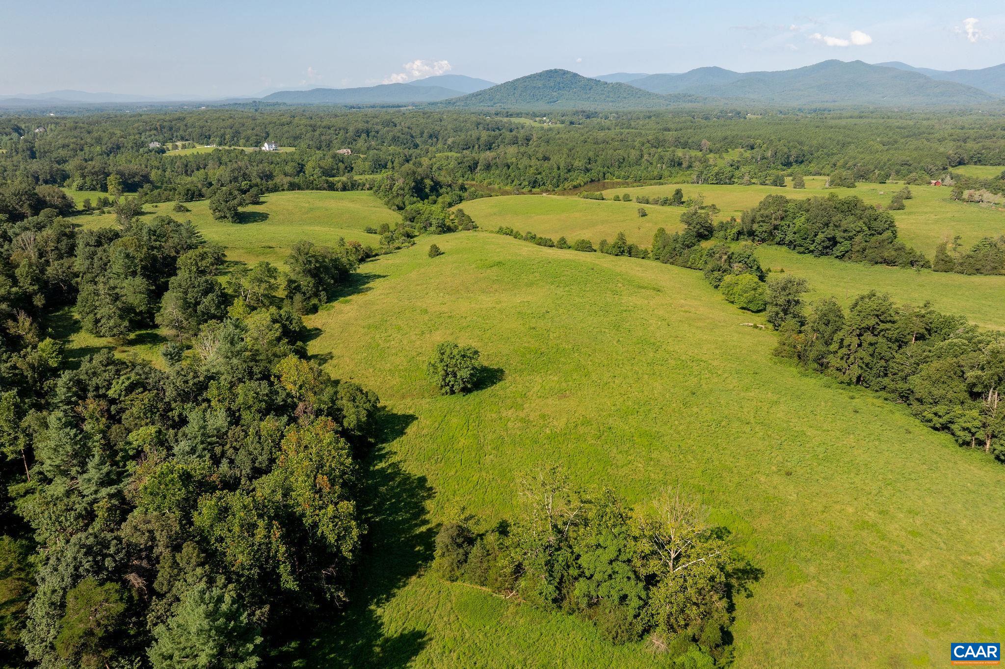955 Simmons Gap Road Dyke, VA 22935 - Photo 4 of 33 a view of a lake with a mountain