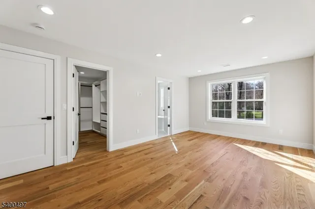 a bathroom with a shower a toilet and a window