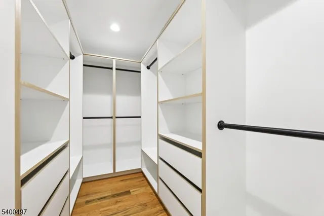 a view of a hallway with washer and dryer