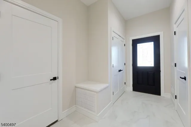 a large kitchen with kitchen island a stove a refrigerator a sink dishwasher with a dining table and chairs