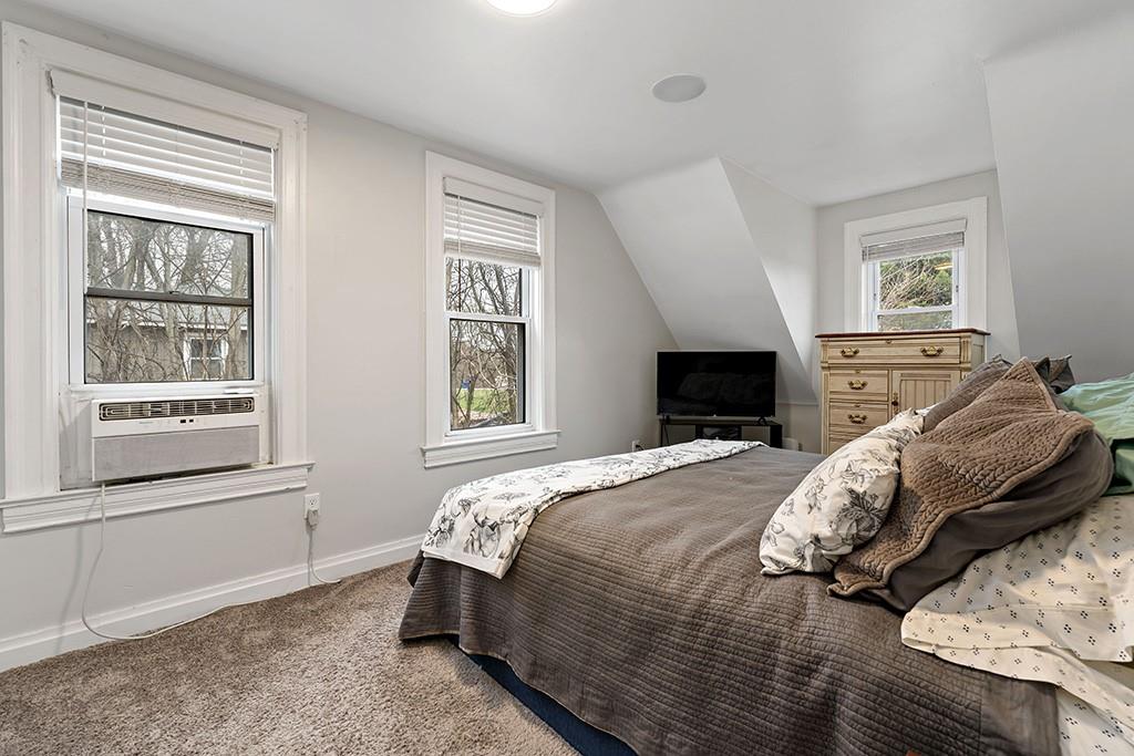 231 Scott Road Pittsburgh, PA 15239 - Photo 14 of 30 a bedroom with a bed and wooden floor
