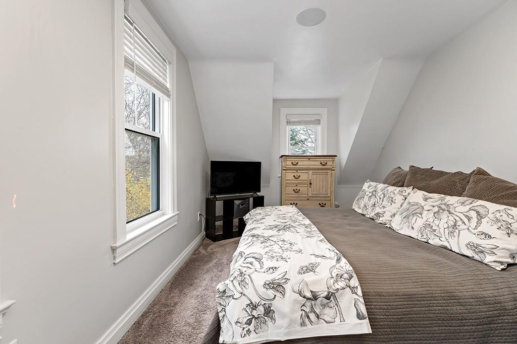 231 Scott Road Pittsburgh, PA 15239 - Photo 15 of 30 a bedroom with a bed and a flat screen tv