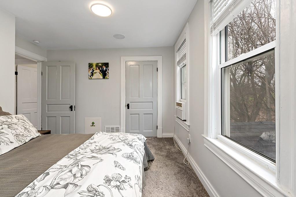 231 Scott Road Pittsburgh, PA 15239 - Photo 16 of 30 a bedroom with a bed and a window