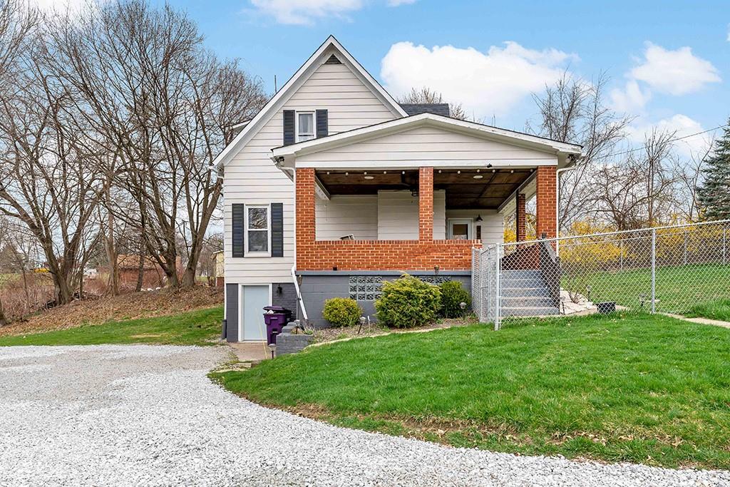 231 Scott Road Pittsburgh, PA 15239 - Photo 2 of 30 a front view of a house with a yard and garage