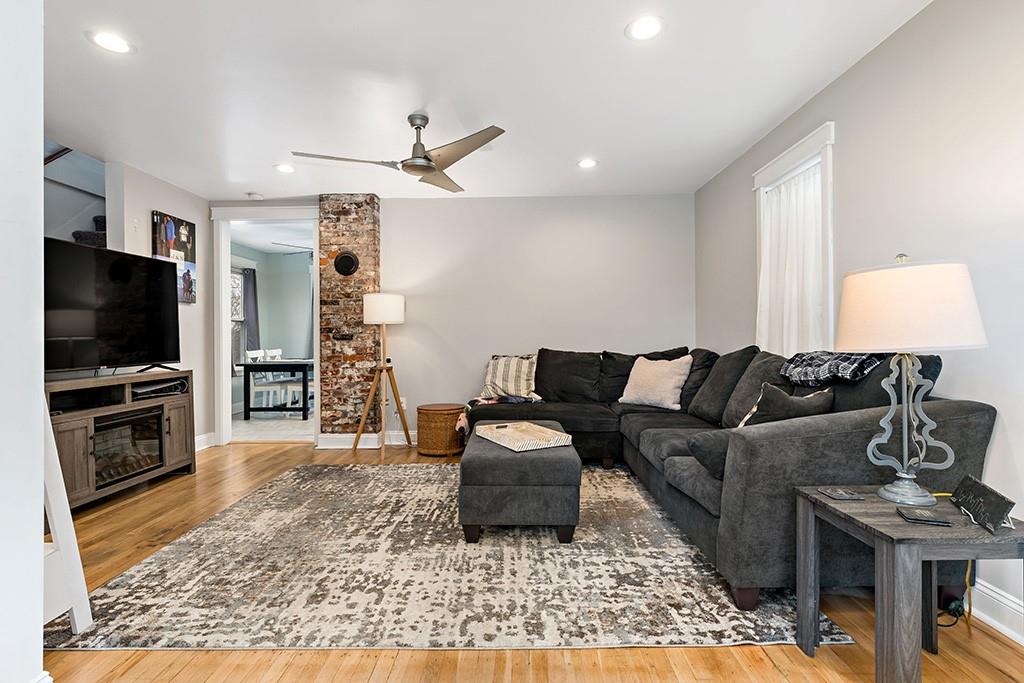 231 Scott Road Pittsburgh, PA 15239 - Photo 5 of 30 a living room with furniture and a flat screen tv