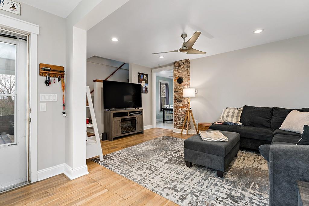 231 Scott Road Pittsburgh, PA 15239 - Photo 6 of 30 a living room with furniture and a flat screen tv