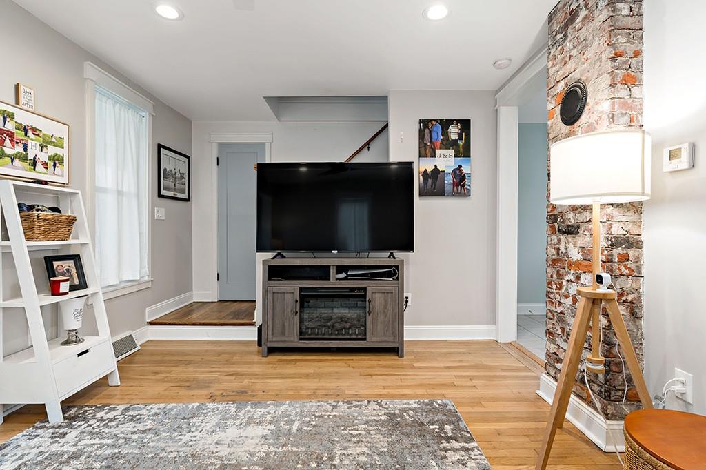 231 Scott Road Pittsburgh, PA 15239 - Photo 7 of 30 a living room with furniture and a flat screen tv