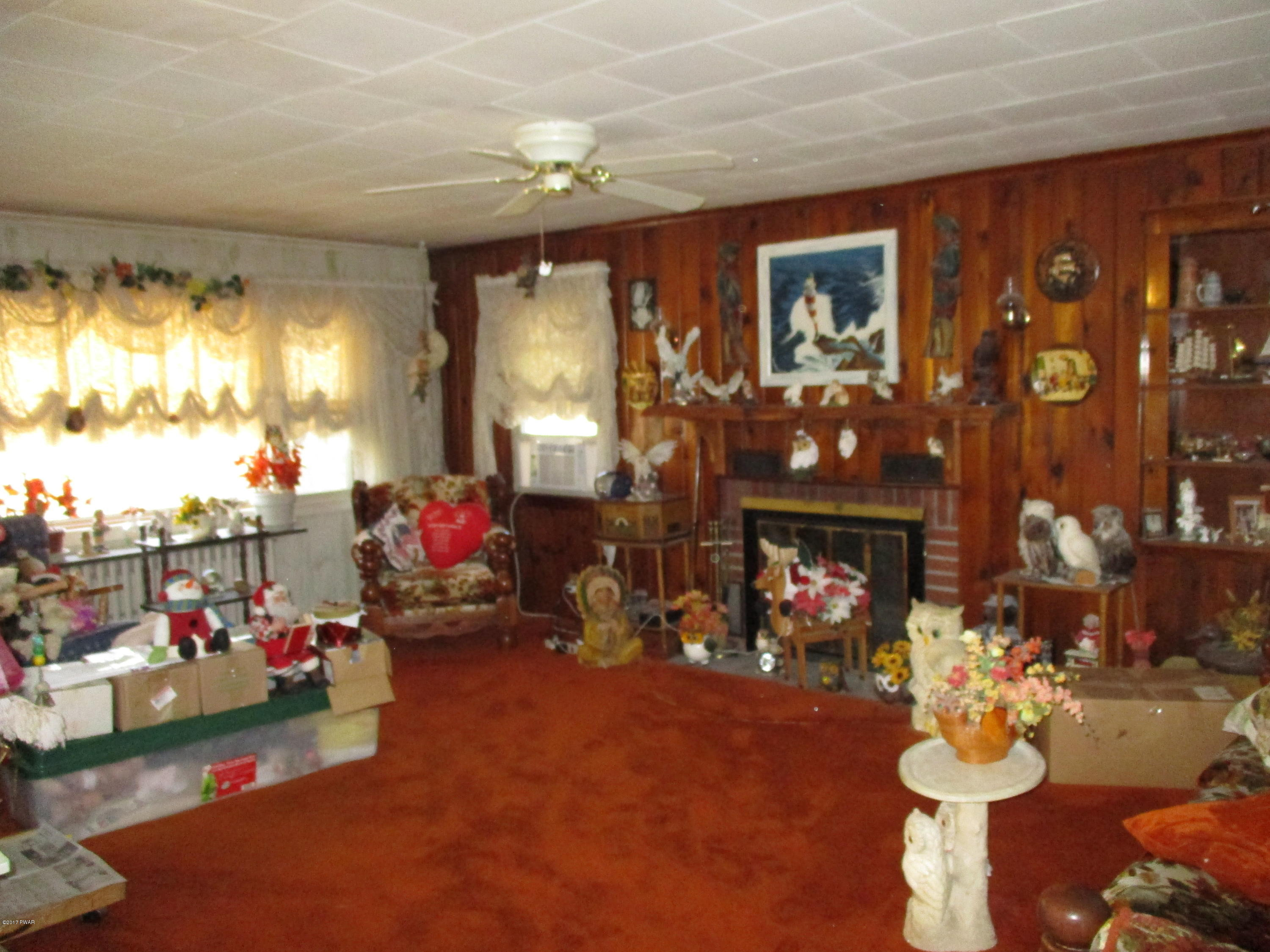 142 Log Tavern Road Milford, PA 18337 - Photo 7 of 24 a living room with fireplace furniture and a fireplace