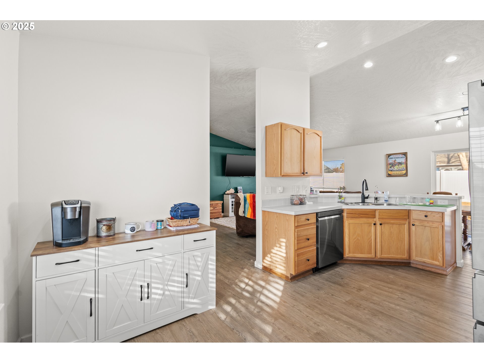620 West Wren Avenue Hermiston, OR 97838 - Photo 18 of 48 a kitchen with a sink and wooden floor