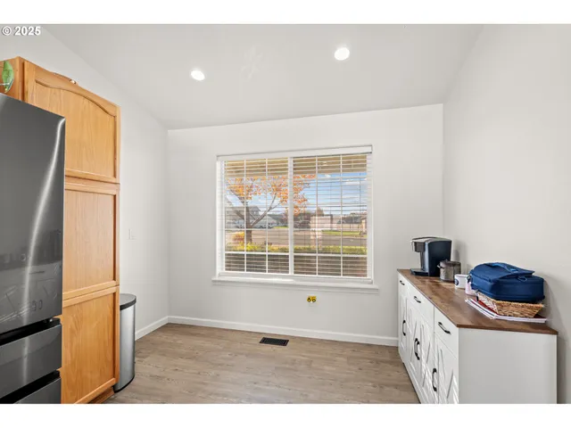 a bedroom with a bed and a tv on dresser