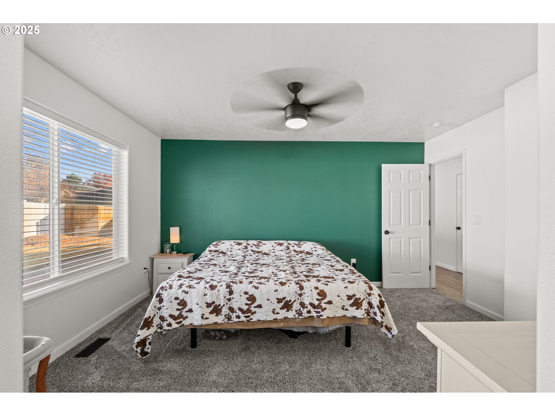 620 West Wren Avenue Hermiston, OR 97838 - Photo 21 of 48 a bedroom with a bed a window and a chandelier