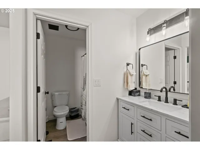 a view of walk in closet with clothes