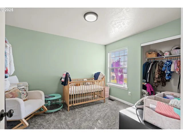 a bedroom with furniture and a window
