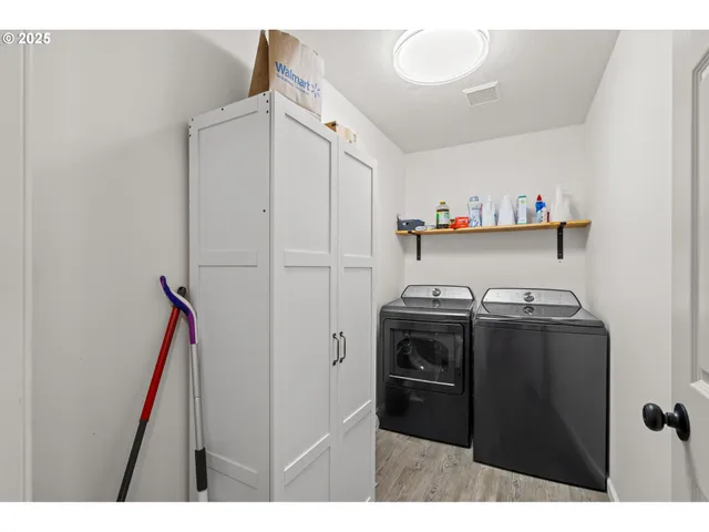 a view of a garage with a bike and white walls
