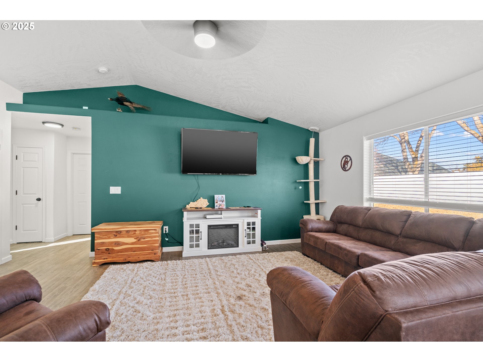 620 West Wren Avenue Hermiston, OR 97838 - Photo 7 of 48 a bedroom with furniture and a flat screen tv