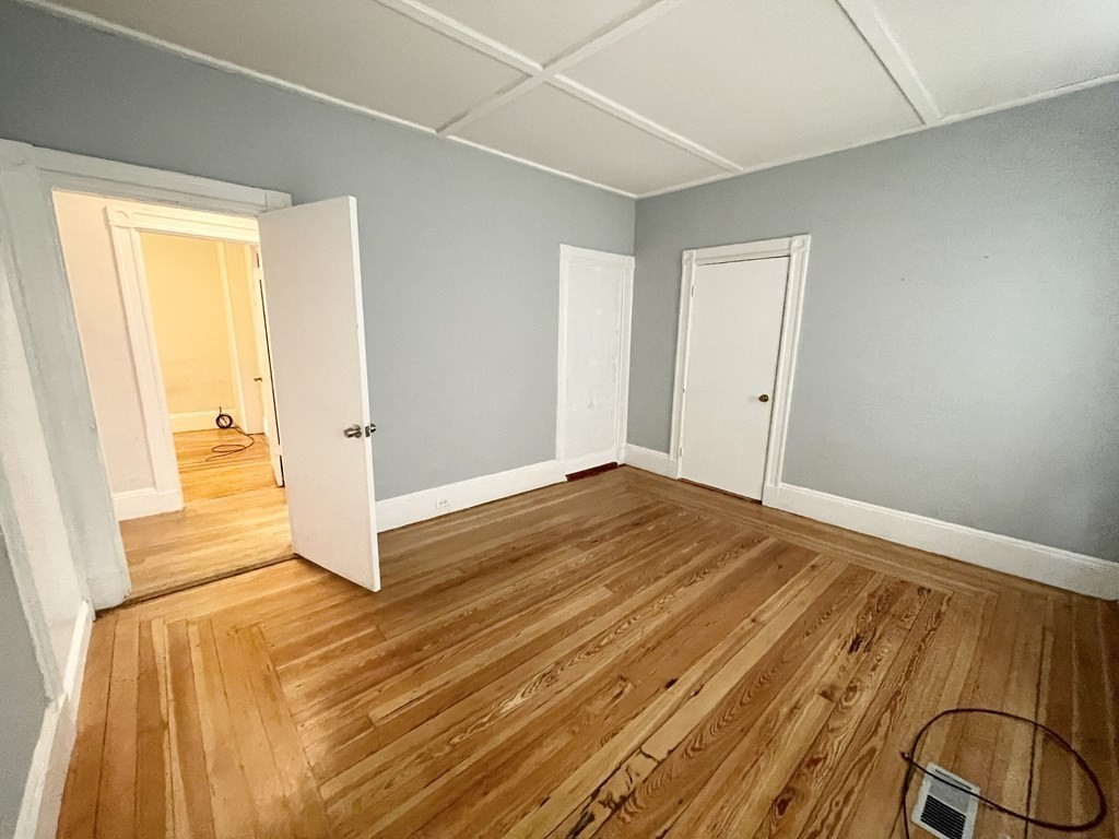 10 Wave Avenue, Unit 1 Boston, MA 02125 - Photo 5 of 9 a view of a room with wooden floor